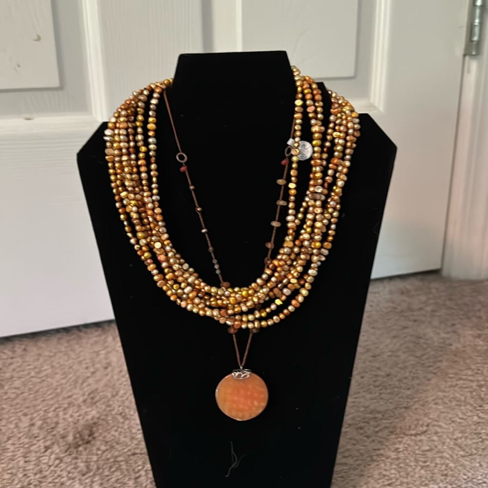 2 orange gold necklaces